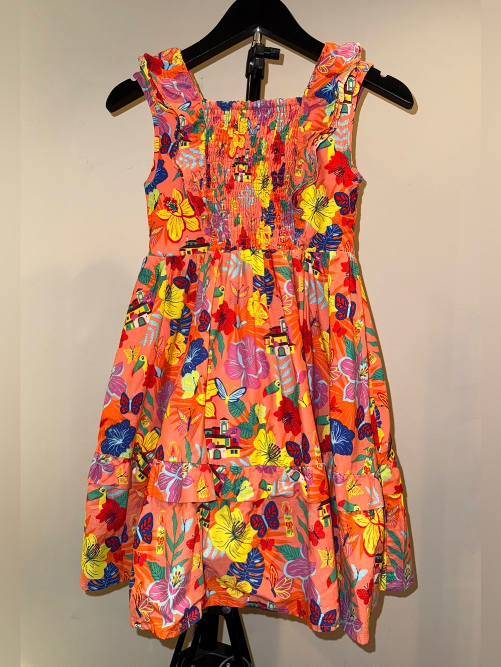 Disney Store Encanto dress in orange with bright prints from the movie, size 7/8